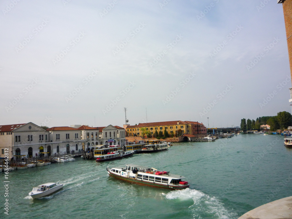Fototapeta premium Exploring the beautiful canals with river taxis in Venice, Italy.
