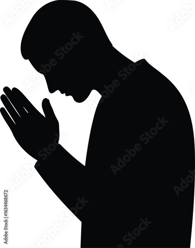 Silhouette of a man praying with hands clasped together in a sign of devotion and religious faith