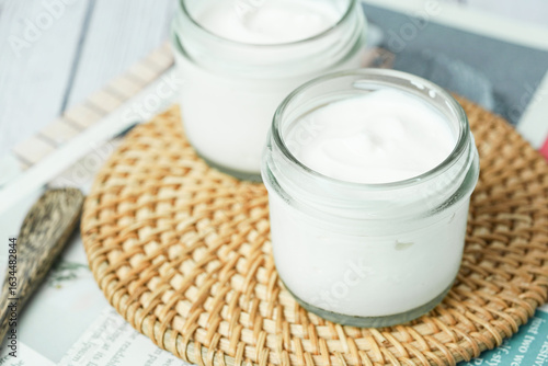 Close up of Homemade Greek Yogurt in a glass jars, selective focus concept. Healthy breakfast and healthy food.