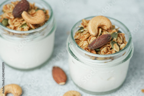 Close up of Homemade healthy breakfast, bowl with greek yogurt and granola.