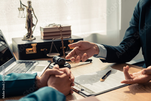 Professional lawyers and businessmen working and talking in law office. Legal concept. Judge's gavel and judge's gavel with scales of justice.