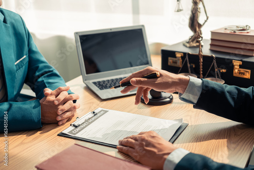 Professional lawyers and businessmen working and talking in law office. Legal concept. Judge's gavel and judge's gavel with scales of justice.