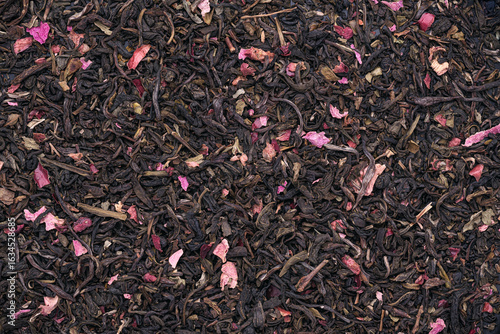 Top view photography of dried Green tea, Spearmint leaves, cranberry bits, and roses petals