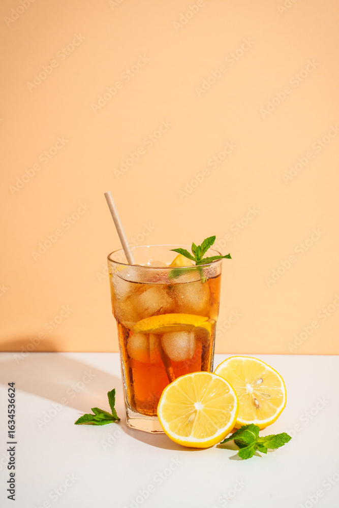 Fototapeta premium Summer cold drink on colored background with hard shadows.