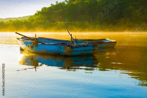 Two Wooden Fishing Canoes on The Calm Caribbean Sea in Morning Sunlight, Destination Cuba