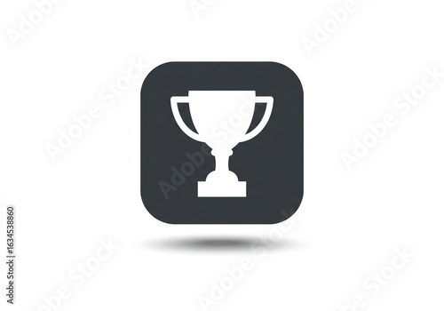 A white trophy icon on a dark gray rounded square with a soft shadow on a plain white background
