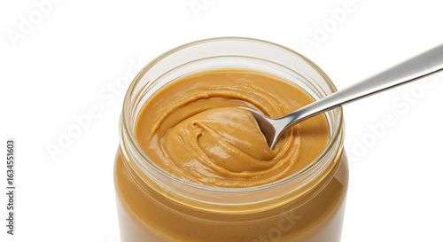 Creamy Peanut Butter in a Glass Jar with Silver Spoon Close Up on White Background for Healthy Eating, Sweet Dessert
