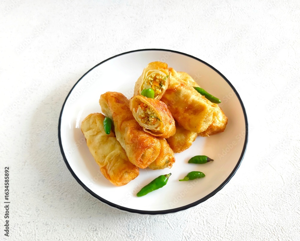 Φωτογραφία Sosis Solo is Indonesian traditional fried egg crepe with sweet and minced chicken filling