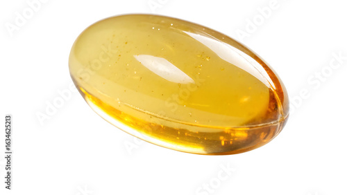 A single translucent golden oval capsule filled with liquid against a stark black background