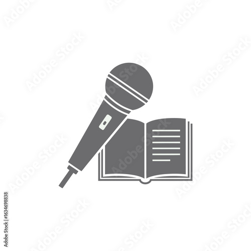 Microphone and open book suggesting podcasting audiobook or similar audio recording concept.