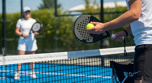 Man Holding Paddle and Tennis Balls on Court with Player