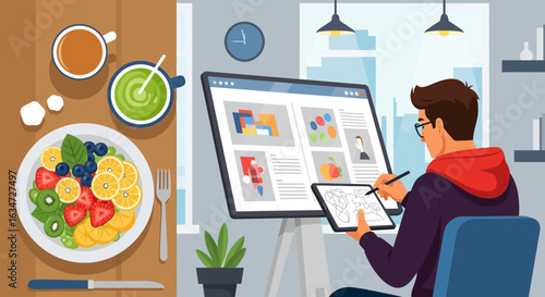 Digital artist working at home with healthy food and drink on the table