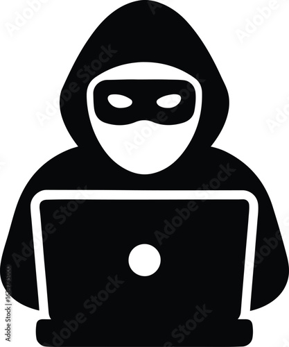 An anonymous hacker is using a laptop to commit cybercrime and steal data from an online computer system