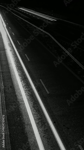 white lines of car lights on black background