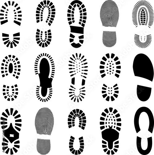 A diverse collection of black and white shoe and boot sole prints.
