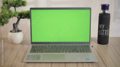 green screen laptop on the table
