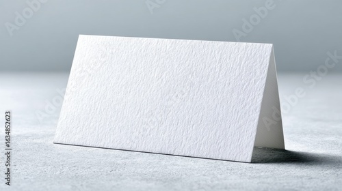Blank White Tent Card Mockup on a Textured Surface