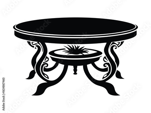  A round ornate wooden table in black and white