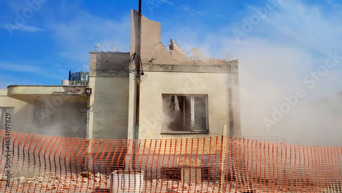 The old building is collapsing and there is dust everywhere