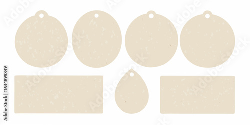 Collection of blank beige tags and labels with textured surface