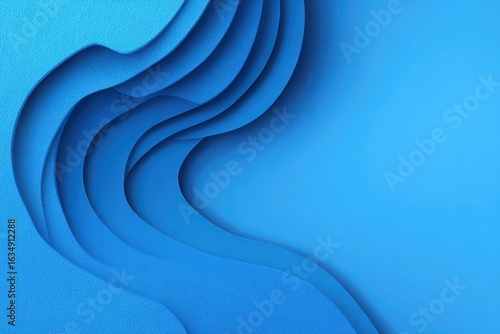 Exploration of abstract blue paper cut design with realistic relief demonstrating vibrant textures and flowing shapes in a modern composition