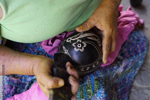 Making of jícara or guacal, which is a small bowl or cup, traditionally made from the dried fruit of the calabash tree (Crescentia cujete). Photos taken in Rabinal, Baja Verapaz, Guatemala