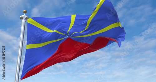 Réunion flag with flagpole waving in wind, rolling clouds background looping, 4K video (Perfect Loop)