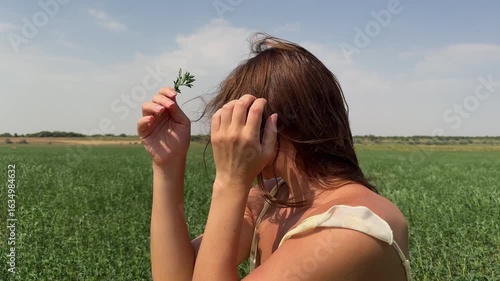 Girl laughing in a green field