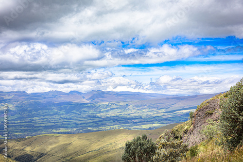 Pichincha Province, Quito, Ecuador - July 5, 2025: The summit of the Sincholagua Volcano, covered by clouds, seen from Pasochoa Volcano, in the Pasochoa Wildlife Refuge.