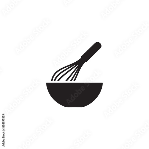 Black whisk mixing in a bowl kitchen cooking