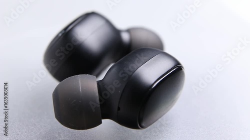 Macro Close up of Bluetooth portable true wireless earbuds
