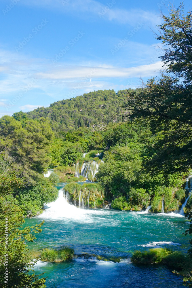 Obraz premium Rushing Waterfalls of Krka on a Bright Summer Day
