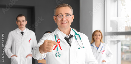 Mature male medic with red ...