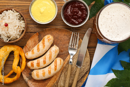 Tasty sausages, pretzel, fl...