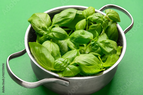 Fresh green basil leaves in...