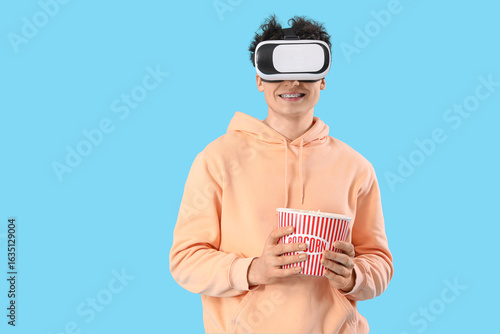 Young man in VR glasses wit...