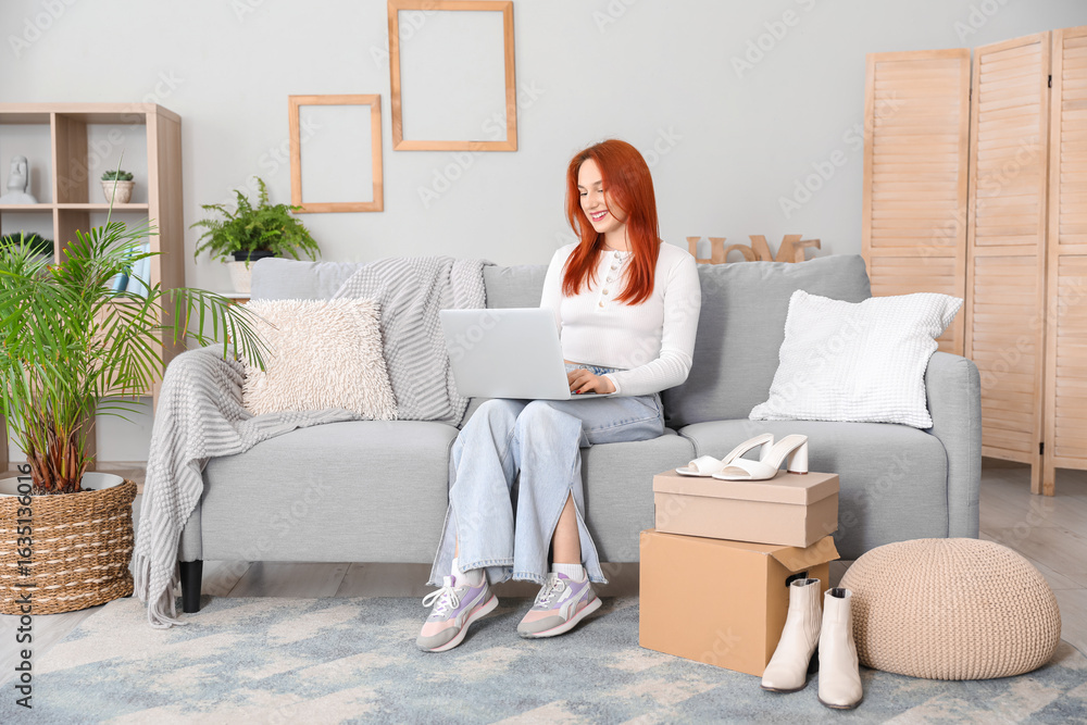 Young woman using laptop with new shoes at home Young woman using laptop with new shoes at home