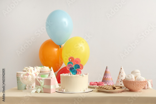 Table with cake, sweets and...