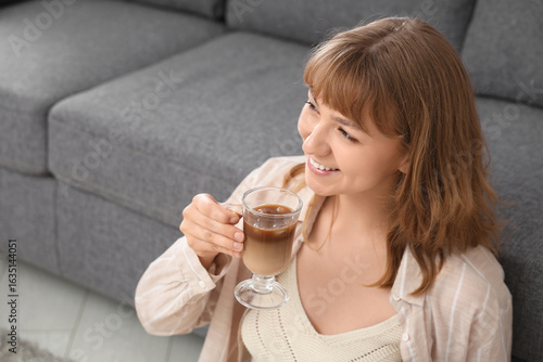 Happy young woman with glas...