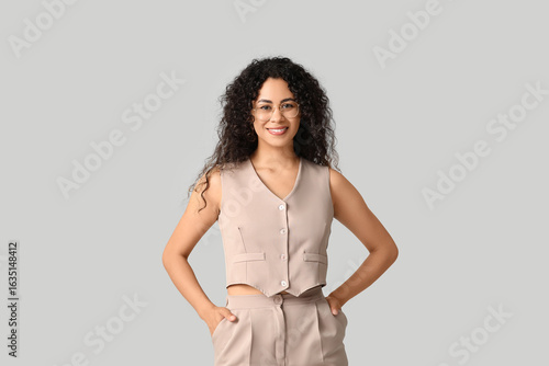 Confident young woman in be...