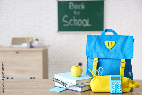 Apple, books, schoolbag and...
