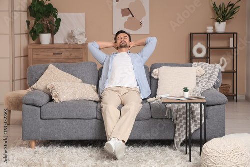 Handsome young man relaxing...