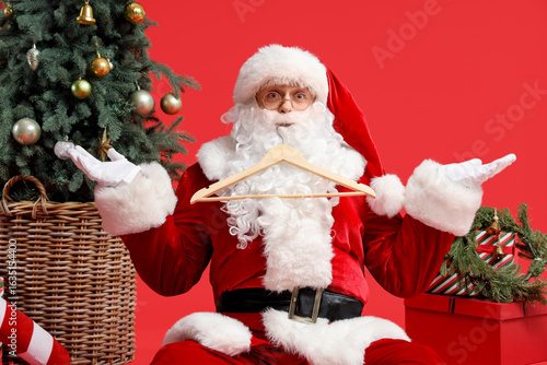 Santa Claus with hangers, g...