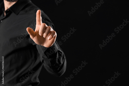 Man's hand pointing forward...