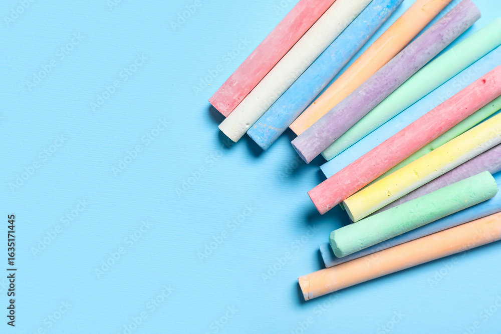Obraz premium Colorful chalks on blue background