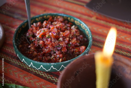 Obraz na płótnie Traditional pico de gallo dish in Guatemala with tomatoes, onions and cilantro