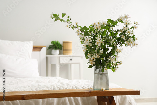 Vase of blooming jasmine fl...