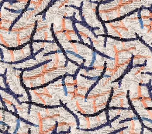 Seamless abstract embroidery vector pattern with stitched lines in coral, beige and blue on textured fabric background