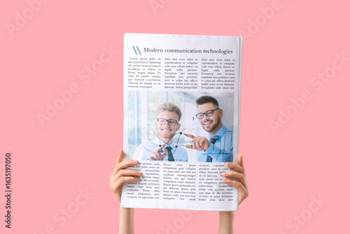 Female hands with newspaper...