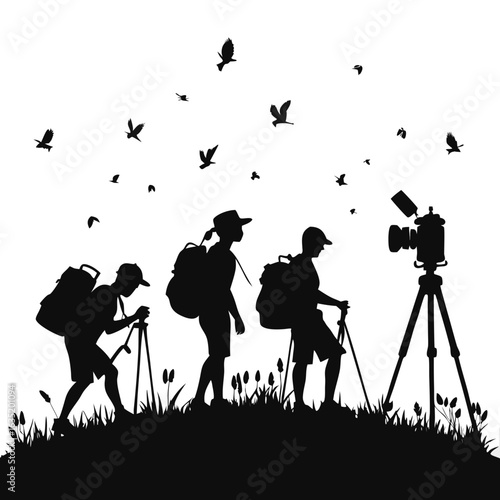 Silhouette of hikers with backpacks and trekking poles observing wildlife with a camera on a tripod